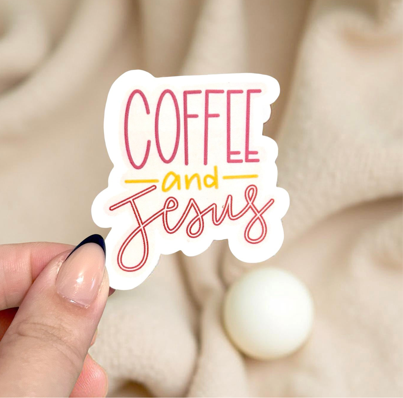 Had holding sticker that says coffee and Jesus