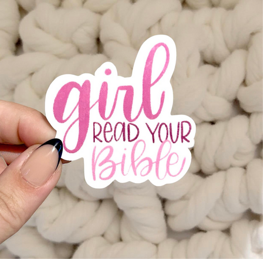 Hand holding sticker that says girl read your Bible