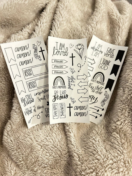 clear bible journal stickers laying out on blanket